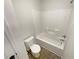 Bathroom featuring a tub and shower combination, toilet and sink at 622 Madison Park Dr, Grayson, GA 30017