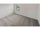 Cozy bedroom featuring soft carpeting and a bright window view at 622 Madison Park Dr, Grayson, GA 30017