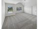Bedroom with large windows, neutral carpet, and lots of natural light at 622 Madison Park Dr, Grayson, GA 30017