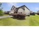 Charming two-story home with a well-manicured lawn at 622 Madison Park Dr, Grayson, GA 30017