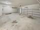 Clean two-car garage featuring two garage doors and concrete flooring at 622 Madison Park Dr, Grayson, GA 30017