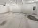 Spacious garage with concrete flooring and a side entrance door at 622 Madison Park Dr, Grayson, GA 30017