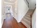 Foyer featuring hardwood floors, staircase and white trim at 622 Madison Park Dr, Grayson, GA 30017