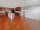 This kitchen features wood floors, a center island, and a stylish dining area at 622 Madison Park Dr, Grayson, GA 30017