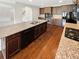 This kitchen has a center island, stainless appliances, and stone countertops at 622 Madison Park Dr, Grayson, GA 30017