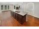 This kitchen features a center island that overlooks the dining and living areas at 622 Madison Park Dr, Grayson, GA 30017