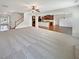 Expansive living room showcases an open-concept design with views to the kitchen and dining areas at 622 Madison Park Dr, Grayson, GA 30017
