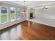 This living room is filled with natural light and gorgeous hardwood flooring at 622 Madison Park Dr, Grayson, GA 30017