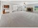 Open-concept living room showcasing a stone fireplace and views into the kitchen at 622 Madison Park Dr, Grayson, GA 30017