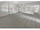 Spacious living room features neutral paint, carpet, and ample natural light at 622 Madison Park Dr, Grayson, GA 30017