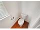Powder room featuring a toilet, towel bar, and window at 622 Madison Park Dr, Grayson, GA 30017