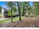 Expansive backyard with mature trees and a multi-level deck at 1379 Cambridge Ne Ct, Brookhaven, GA 30319