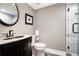 Elegant bathroom with a glass shower, granite countertop, and stylish fixtures at 1379 Cambridge Ne Ct, Brookhaven, GA 30319