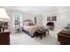 Spacious bedroom with plush carpeting, large windows, and comfortable furnishings at 1379 Cambridge Ne Ct, Brookhaven, GA 30319