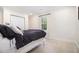 Bright bedroom with a white iron bed frame and a view of nature at 1379 Cambridge Ne Ct, Brookhaven, GA 30319