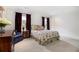 Cozy bedroom with floral bedding, a comfortable chair, and soft lighting at 1379 Cambridge Ne Ct, Brookhaven, GA 30319