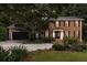 Charming two-story brick home with a well-manicured lawn and mature landscaping at 1379 Cambridge Ne Ct, Brookhaven, GA 30319