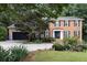 Charming two-story brick home with a well-manicured lawn and mature landscaping at 1379 Cambridge Ne Ct, Brookhaven, GA 30319