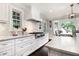 Modern kitchen with marble countertops, custom cabinets, and high-end stainless steel appliances at 1379 Cambridge Ne Ct, Brookhaven, GA 30319