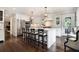 Bright kitchen featuring an island with seating, stainless steel appliances, and stylish decor at 1379 Cambridge Ne Ct, Brookhaven, GA 30319