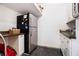 Functional laundry room with sink, cabinetry, and modern stainless steel refrigerator at 1379 Cambridge Ne Ct, Brookhaven, GA 30319