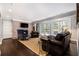 Comfortable living room featuring a brick fireplace, french doors, and hardwood floors at 1379 Cambridge Ne Ct, Brookhaven, GA 30319