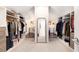 Large walk-in closet featuring custom shelving and ample storage space at 1379 Cambridge Ne Ct, Brookhaven, GA 30319