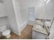 Bathroom featuring a double sink vanity, granite countertops, tile floors and shower/tub at 2231 Mill Garden Pl, Buford, GA 30519
