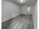 A carpeted bedroom featuring neutral paint, with an open doorway to an additional room at 2231 Mill Garden Pl, Buford, GA 30519