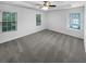 Bright bedroom features large windows, neutral paint and carpet at 2231 Mill Garden Pl, Buford, GA 30519