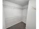 Walk-in closet with ample shelving and storage space for organizing wardrobes and accessories at 2231 Mill Garden Pl, Buford, GA 30519