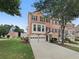 Charming brick townhouse with a two-car garage and well-maintained landscaping at 2231 Mill Garden Pl, Buford, GA 30519