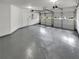 Spacious two-car garage with epoxy floors and modern lighting at 2231 Mill Garden Pl, Buford, GA 30519