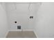 Efficient laundry room with washer and dryer hookups and plenty of storage space at 2231 Mill Garden Pl, Buford, GA 30519