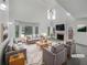 Bright living room with high ceilings, fireplace, and lots of natural light at 2231 Mill Garden Pl, Buford, GA 30519