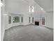 Open living room features soaring ceilings, fireplace, and lots of windows at 2231 Mill Garden Pl, Buford, GA 30519