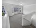 Cozy loft area with plenty of natural light, perfect for a home office or playroom at 2231 Mill Garden Pl, Buford, GA 30519