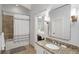 The bathroom has a tub with a shower, granite countertop vanity, and tile floors at 3401 Stillhouse Se Rd, Atlanta, GA 30339