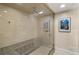 Contemporary bathroom features a glass-enclosed shower with built-in seating at 3401 Stillhouse Se Rd, Atlanta, GA 30339