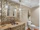Elegant bathroom featuring a unique mirror, stylish lighting, and custom sink at 3401 Stillhouse Se Rd, Atlanta, GA 30339