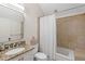 The bathroom includes a tile shower-tub and a vanity with a granite countertop at 3401 Stillhouse Se Rd, Atlanta, GA 30339