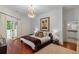 This bedroom features a chandelier and balcony at 3401 Stillhouse Se Rd, Atlanta, GA 30339
