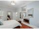 This bedroom features multiple mirrors and hardwood floors at 3401 Stillhouse Se Rd, Atlanta, GA 30339