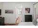 Hallway leading from main bedroom to main bathroom with hardwood floors and neutral paint at 3401 Stillhouse Se Rd, Atlanta, GA 30339