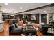 Inviting living area with archways, kitchenette, comfortable seating, and rich hardwood floors at 3401 Stillhouse Se Rd, Atlanta, GA 30339