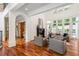 Bright living room features large windows, fireplace, hardwood floors, and white trim at 3401 Stillhouse Se Rd, Atlanta, GA 30339