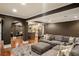 Relaxing living room featuring a cozy sectional sofa, kitchenette and archways at 3401 Stillhouse Se Rd, Atlanta, GA 30339