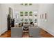 Bright living room with fireplace, hardwood floors, large windows, and high ceilings at 3401 Stillhouse Se Rd, Atlanta, GA 30339