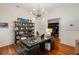 Bright office with large desk, hardwood floors, modern chandelier, and natural light at 3401 Stillhouse Se Rd, Atlanta, GA 30339