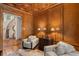 Office boasts wood paneling, decorative ceiling, hardwood floors, and an adjacent curved staircase at 3401 Stillhouse Se Rd, Atlanta, GA 30339
